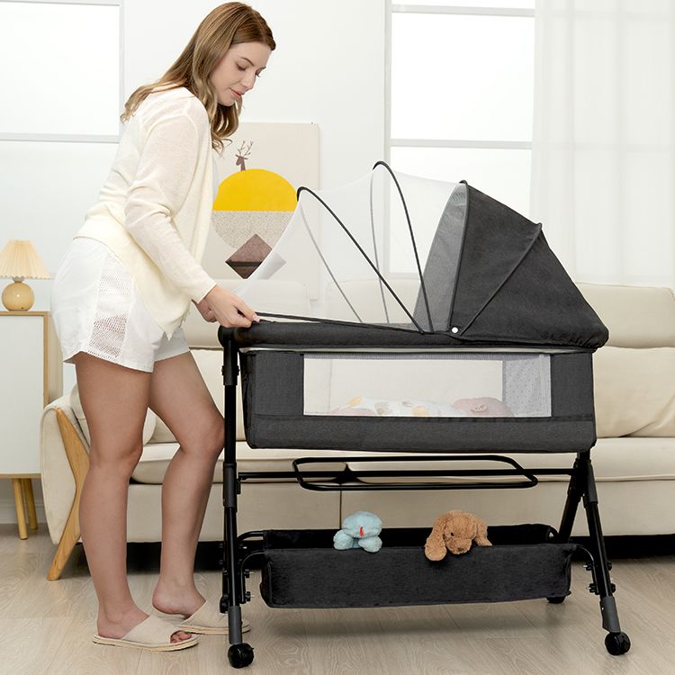 BCOL bassinet with the mosquito net folded over the top