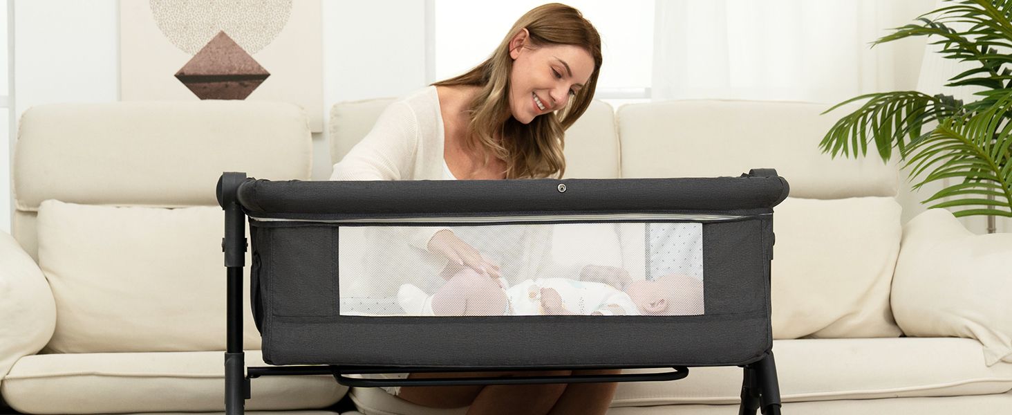 BCOL Dark Grey bassinet beside the sofa