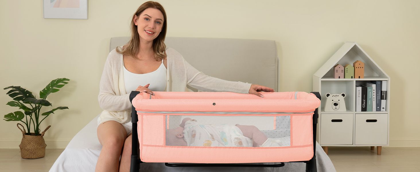 BCOL Pink bassinet beside the sofa